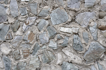 Abstract background of many large stones. Blank stone surface with a neutral color.