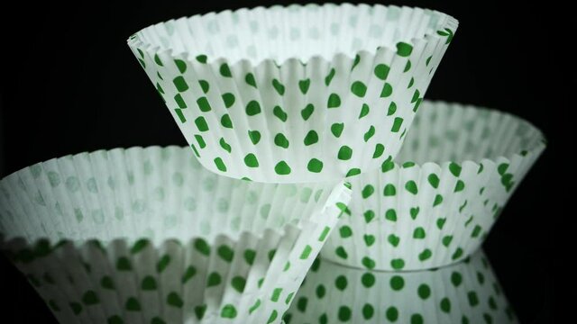 Stack Of Green Polka Dots Cupcake Paper Cups - Cupcake Liners. - macro, rotating