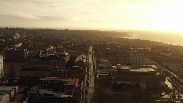 Aerial footage of Varberg, Sweden. Filmed in november at sunset with 4k Drone. Central Varberg with sunset going down.