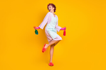 Full length body size view of attrcative cheerful housemaid using chemical jumping isolated on bright yellow color background