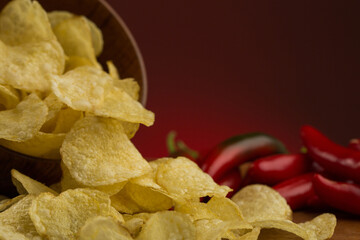 Potato chips and sweet red peppers in studio 