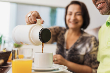 Latin American family having breakfast at home