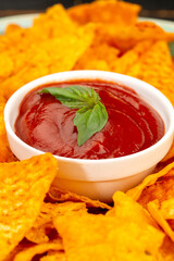 Corn chips with sauce in studio