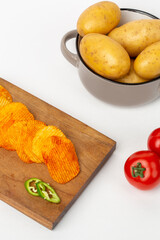 Potato chips in composition and vegetables