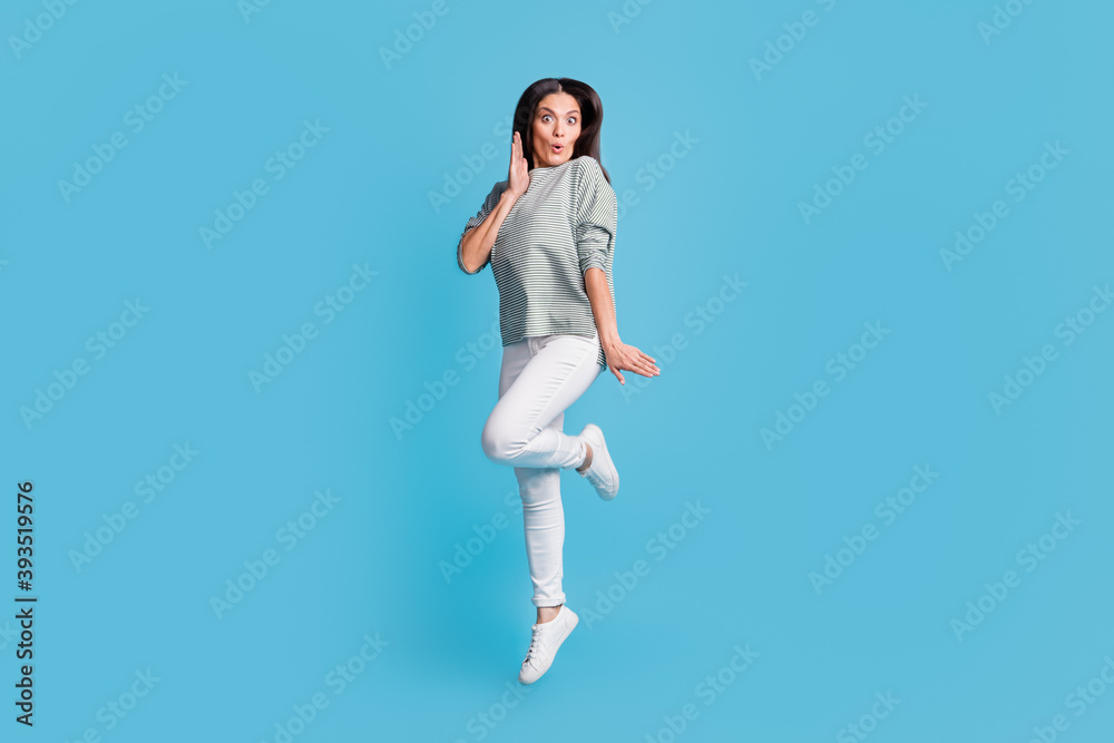 Sticker Full size portrait of attractive lady jumping arm near face lips wow unexpected reaction isolated on blue color background