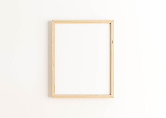 Vertical 8x10 Wood Frame Mockup. Vertical Wood Frame on a white wall.