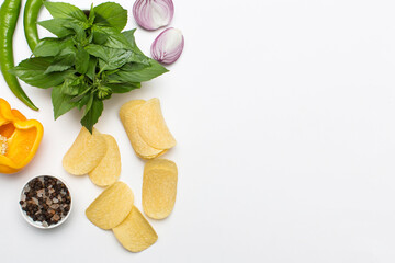potato chips and spices on white background