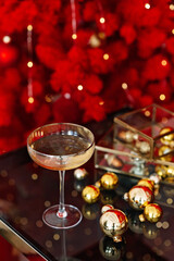 Christmas and New Year background. A glass of champagne against a background of bokeh lights.