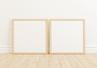 Fototapeta na wymiar Double 8x8 Square Wooden Frame mockup on wooden marble and white wall. Two empty poster frame mockup on wooden floor and white background. 3D Rendering