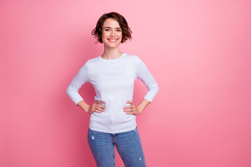Portrait of cute sweet girl look toothy smile put hands waist isolated over pastel color background