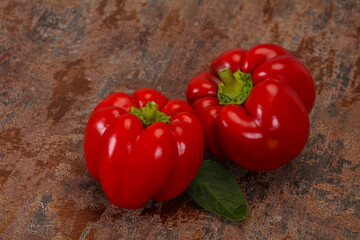 Ripe Red bell pepper over wooden