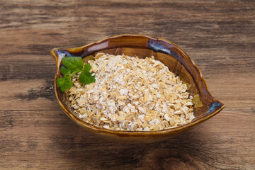 Raw oats in the bowl