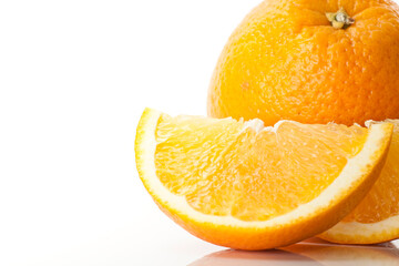 Closeup of a sliced orange fruit on white background.