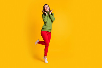 Fototapeta na wymiar Full length body size view o pretty delighted cheerful thin girl jumping having fun isolated on bright yellow color background