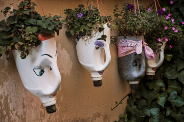 Detail of recycled plastic bottles as flower pots in Covarrubias, a village of Burgos, Spain