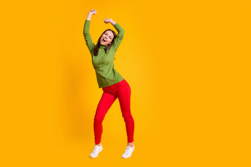 Fototapeta na wymiar Full length body size view of attractive ecstatic funky cheery girl dancing having fun nightclub isolated bright yellow color background