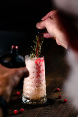 the bartender is preparing a cocktail