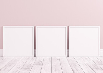 Three square white frame mockups for nursery or kids room. Children room nursery mockup frame poster on clean pink wall and white wood floor.