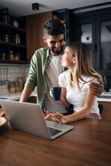 Happy couple working from home