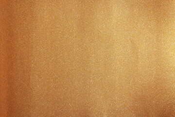 Photo of golden glittery paper texture, wrapping paper