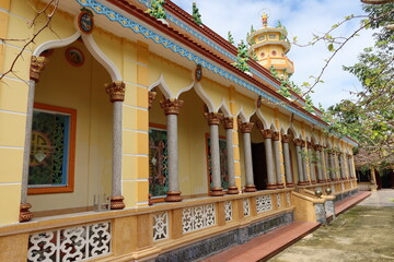 Hoi An, Vietnam, November 19, 2020: Side facade with arches of the Cao Dai temple in Hoi An