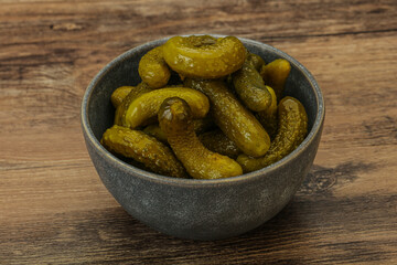 Pickled gherkin in the bowl