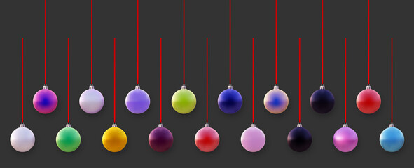 Set of multicolored christmas tree balls on red ribbons.