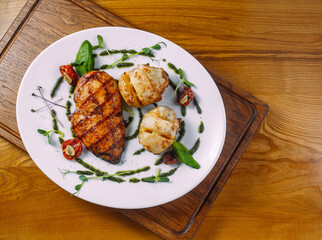 chicken steak with sauce and garnish
