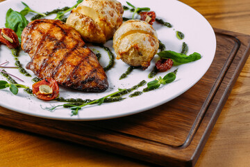 chicken steak with sauce and garnish