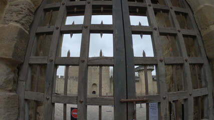 Carcassonne / France - March 11, 2020 - The Château Comtal - entrance from the Cité. The chateau...