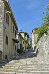 Obraz premium A narrow street among the old houses of Patrica, a medieval village in the Lazio region, Italy. 