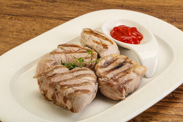 Grilled pork tenderlion with tomato sauce