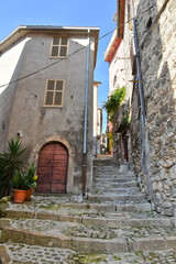 A narrow street among the old houses of Patrica, a medieval village in the Lazio region, Italy.
