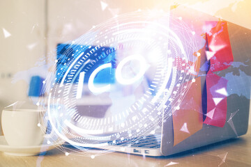 Multi exposure of blockchain and crypto economy theme hologram and table with computer background. Concept of bitcoin cryptocurrency.