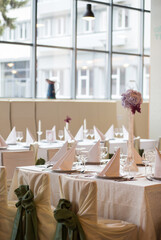 Beautiful tables decorated and prepared for a wedding reception.