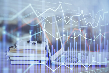 Stock market graph on background with desk and personal computer. Double exposure. Concept of financial analysis.