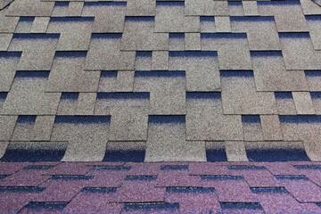 Asphalt roofing in symmetrical pattern. Composite shingle. Repeating tile.