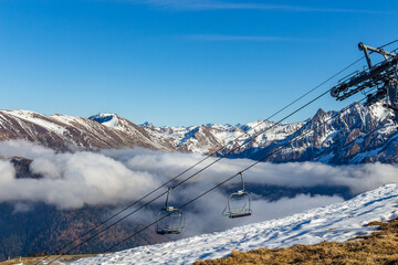 Chair ski lift station at Luchon Superbagnères Ski Resort in the Arrondissement of Saint-Gaudens, Occitania.The Luchonnais Mountains aerial view.