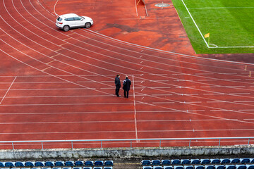 athletic stadium without spectators during a football match at the time of the coronavirus