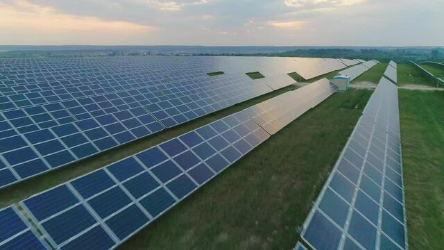 Aerial view of solar power farm with big amount of sollar cells. Concept of renewable sun energy, future technology.