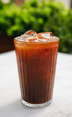 A glass of cold brew ice coffee. Cold brewed iced coffee with ice cubes.