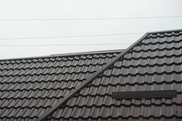 Close-up of brown tiled roof in overcast day