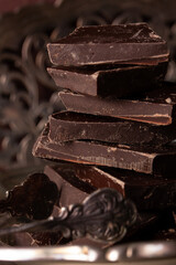 Pieces of dark chocolate stacked on top of each other