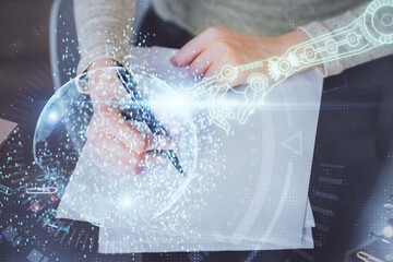 Double exposure of writing hand on background with data solution technology hologram. Ai concept.