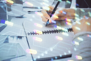 Double exposure of writing hand on background with data solution technology hologram. Ai concept.