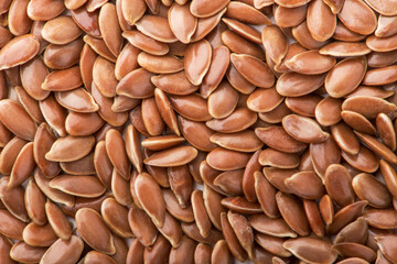 Brown flax seeds background texture