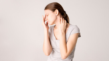 Young beautiful woman has headache