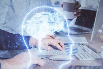 Man with computer background with brain theme hologram. Concept of brainstorm. Double exposure.