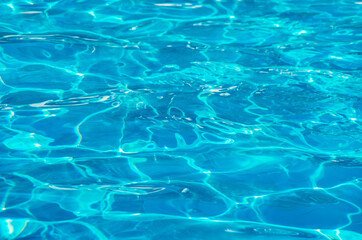 water in swimming pool rippled water detail background