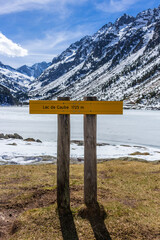 Frozen Gaube Lake (Lac de Gaube) and altitude of the sea level information in the French Pyrenees, in the department of the Hautes-Pyrénées, Cauterets, France. The Mount Vignemale in the background.